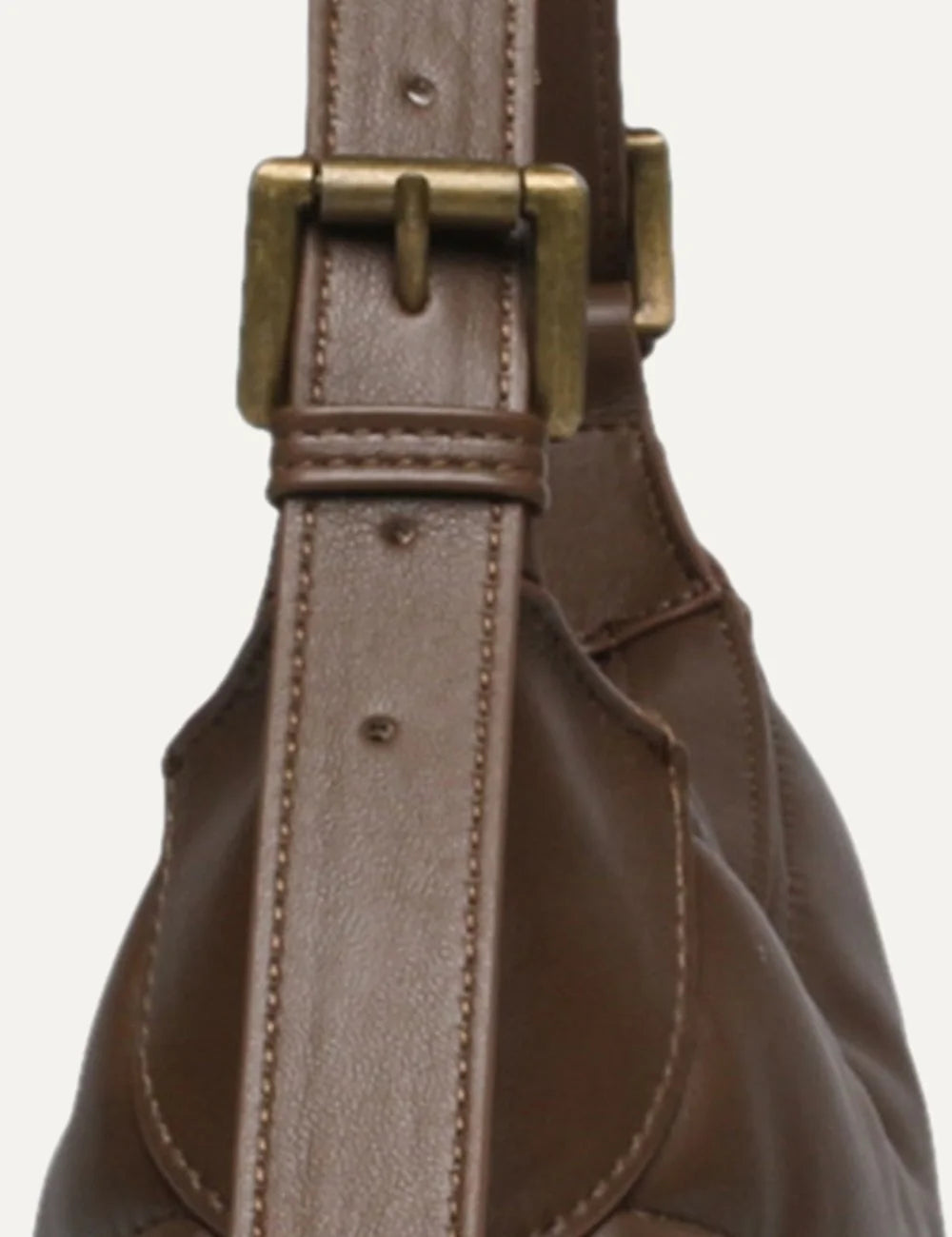 Steve Madden women's chocolate brown quilted shoulder bag with horizontal padded stitching, curved silhouette, slim shoulder strap, antique gold tone SM logo and top zip closure,  strap details