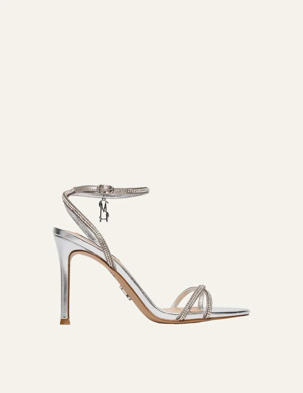 Steve Madden Jypsey-CNR women's silver metallic high heel sandals featuring rhinestone embellished straps, square open toe, adjustable ankle strap with logo charm and slim heel, side view.