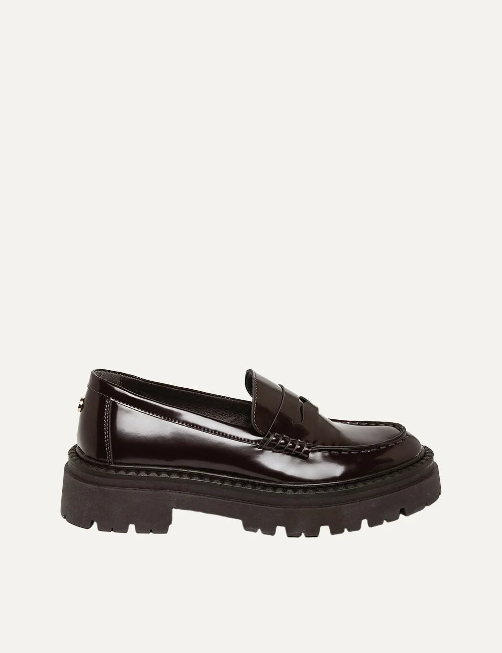 Steve Madden Katja women's dark brown glossy synthetic penny loafers featuring a classic vamp strap, moc toe stitching, slip-on design and chunky dark brown lug sole, side view.