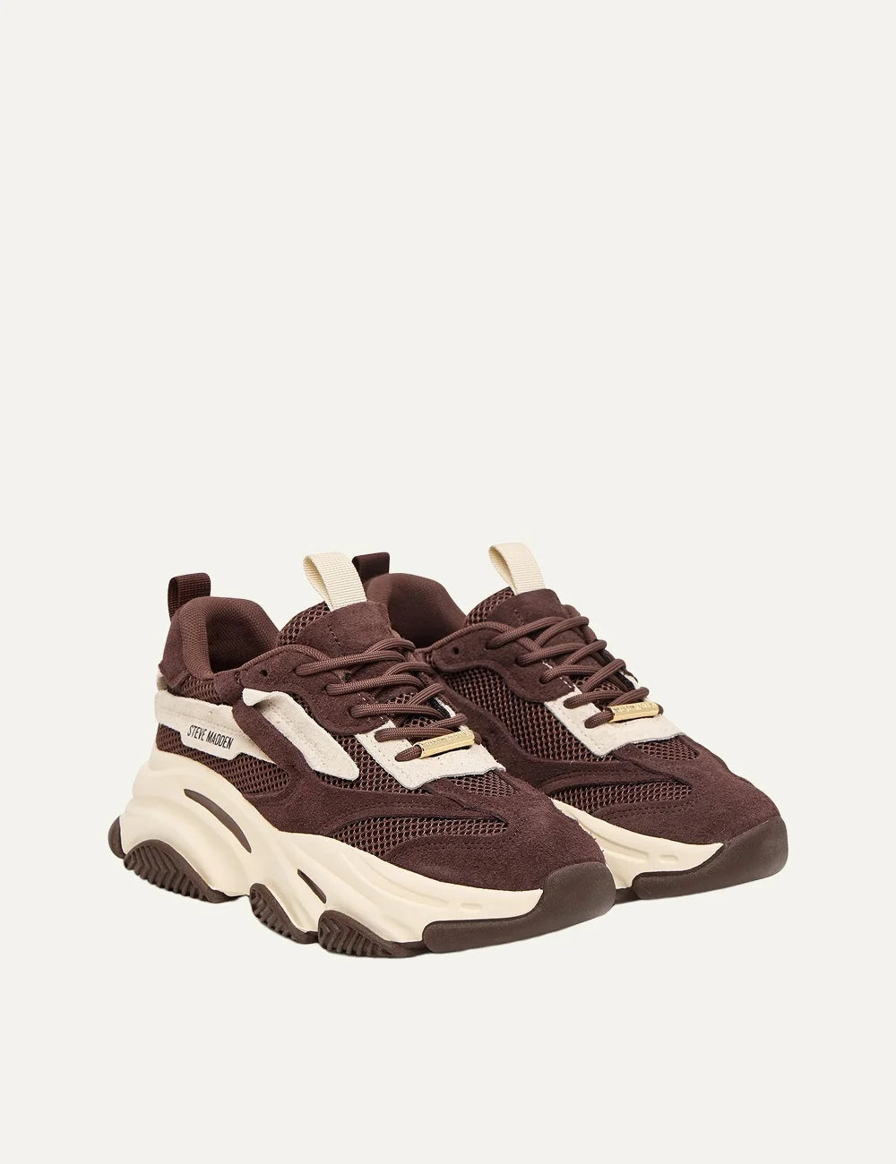 Steve Madden Possession-E women's chunky sneakers in brown and off-white, featuring suede-effect overlays, brown mesh panels, off-white side accents, lace-up fastening, Steve Madden side logo and oversized cream sculpted sole, front angle view