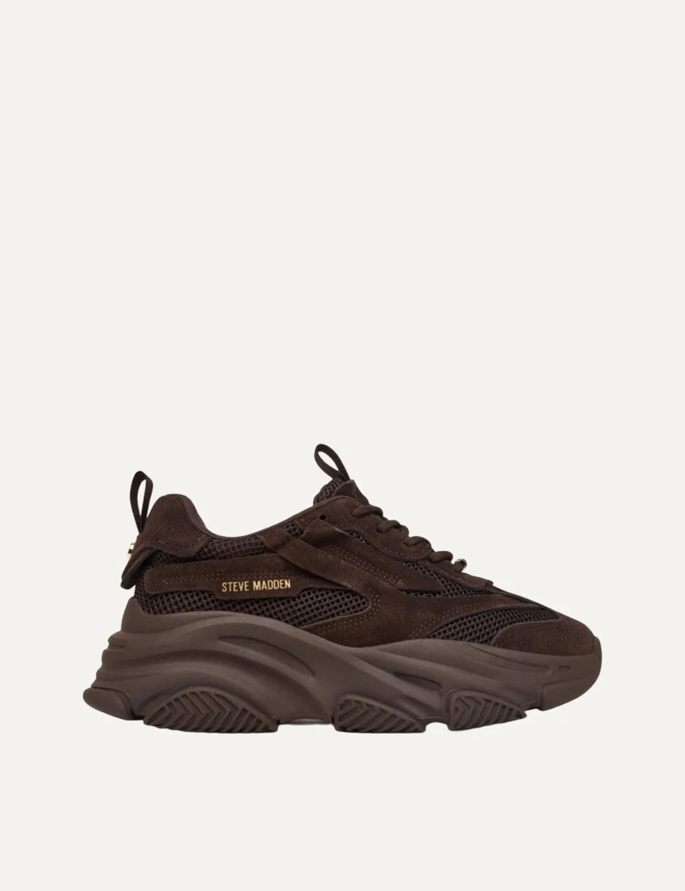 Steve Madden Possession-E women's chunky sneakers in chocolate brown, featuring suede-effect overlays, mesh panels, lace-up fastening, gold-tone side logo and oversized sculpted sole, side view.