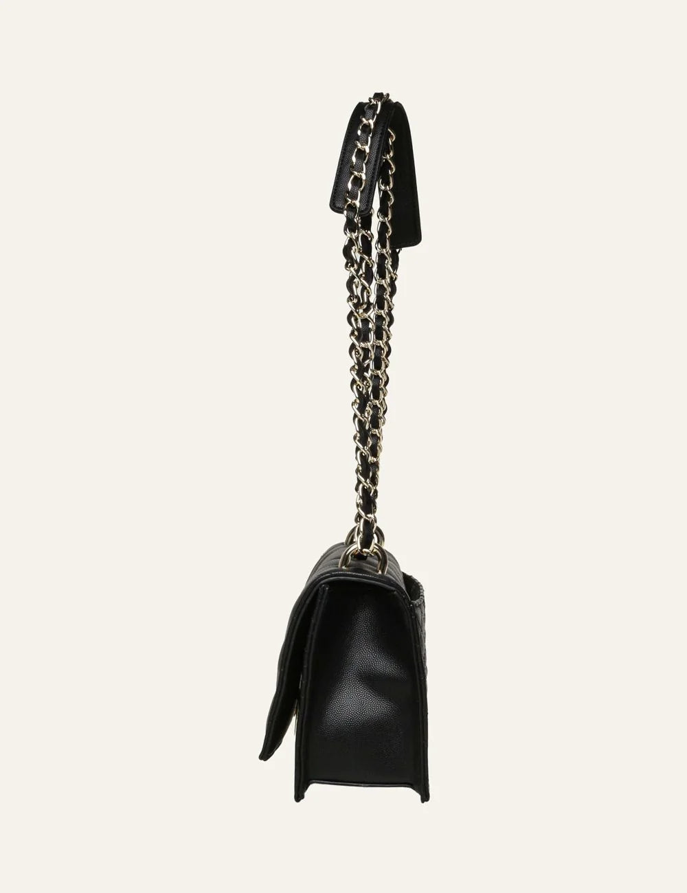 Steve Madden women's black quilted flap shoulder bag with chevron stitching, gold tone metal logo and double gold chain strap interwoven with black material, side view