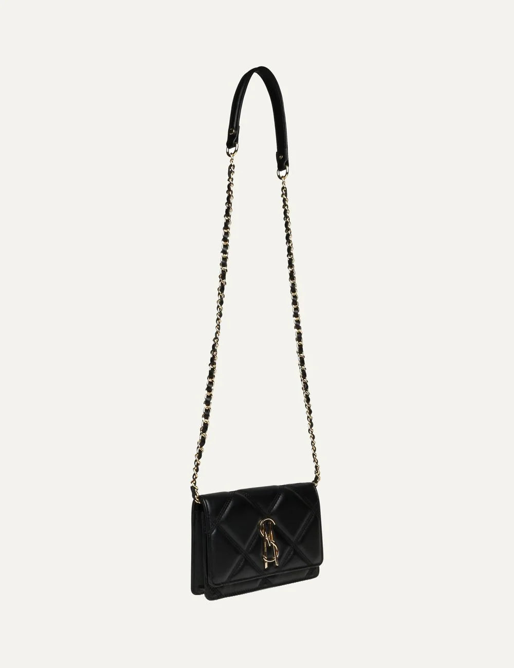 Steve Madden women's black quilted crossbody bag with diamond stitching, gold tone SM logo on front flap, and gold chain strap with woven black detailing, front view with chain