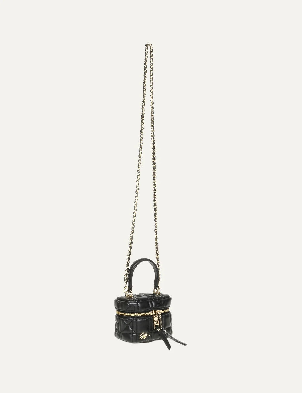 Steve Madden women's mini black quilted synthetic leather handbag with top handle, gold tone double zip closure, elongated zipper pulls and gold SM logo on the front, front view with chain