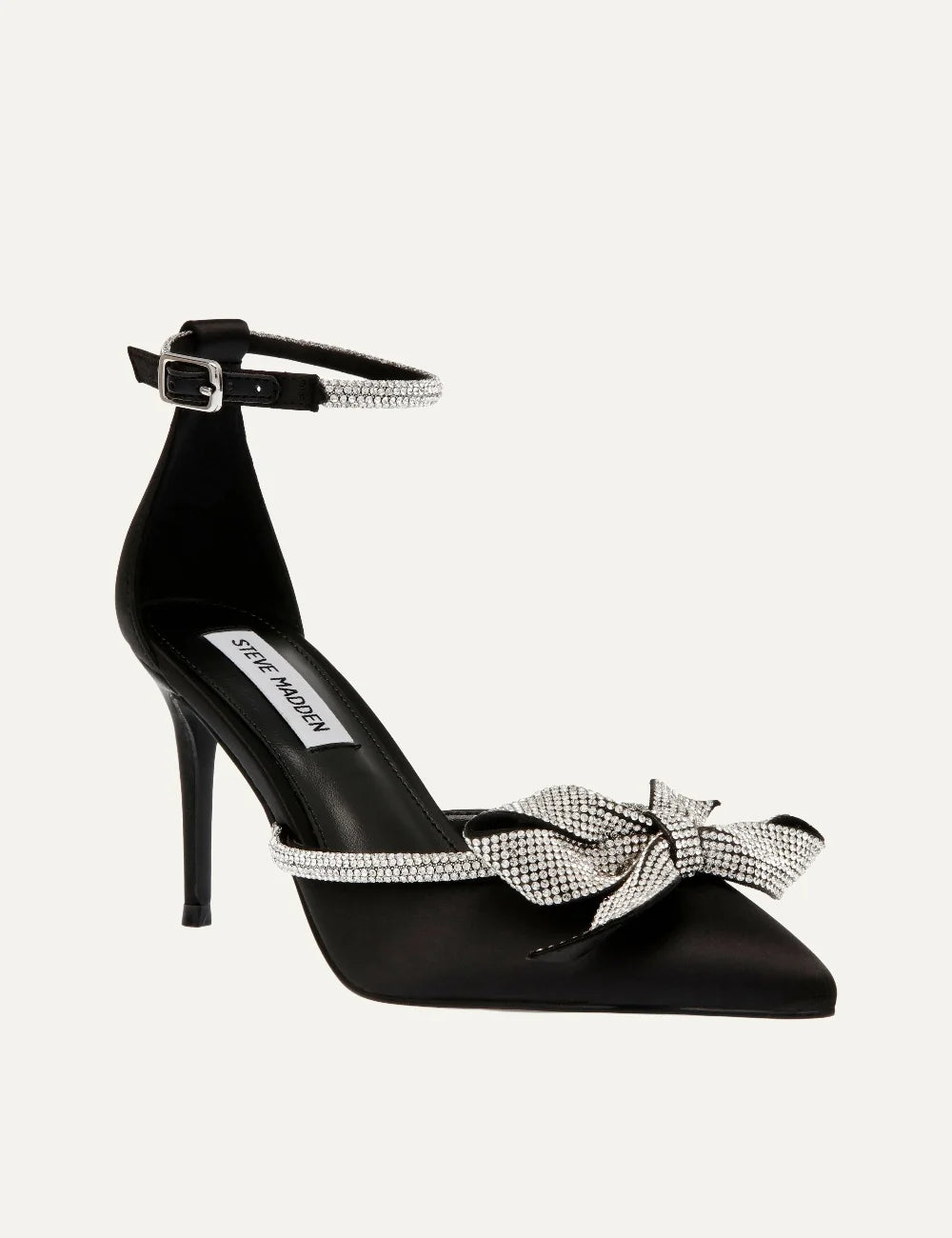 Steve Madden women's black satin pointed toe pumps with sparkling rhinestone bow, crystal embellished trim, adjustable ankle buckle strap and 9 cm stiletto heel, front angle view