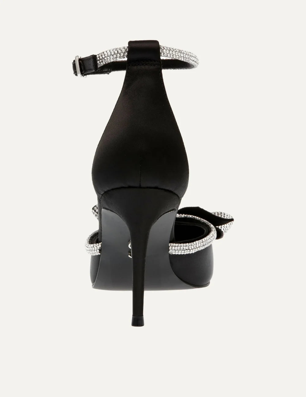 Steve Madden women's black satin pointed toe pumps with sparkling rhinestone bow, crystal embellished trim, adjustable ankle buckle strap and 9 cm stiletto heel, back view