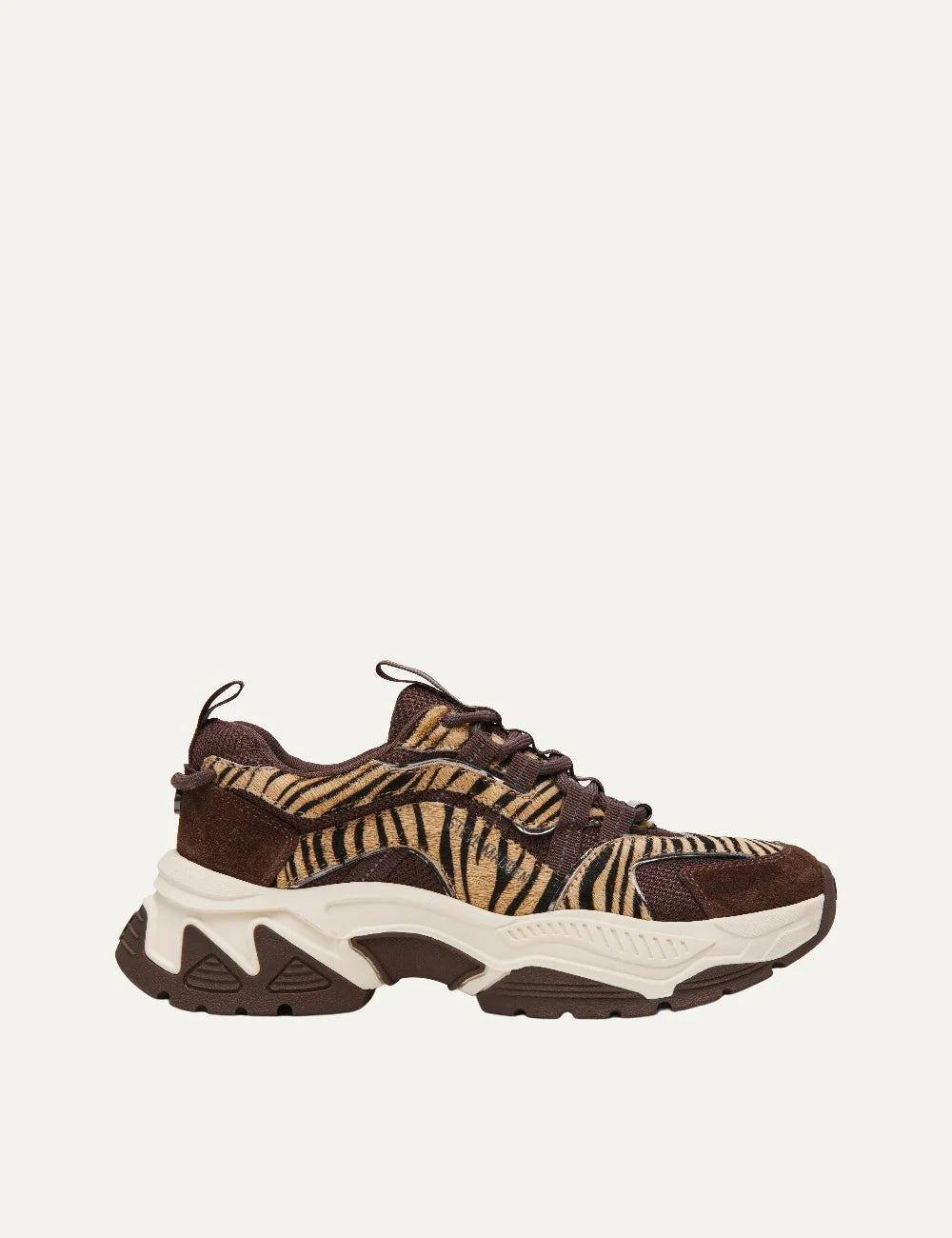 Steve Madden women's chunky sneakers in brown and taupe with tiger stripe patterned fabric panels, dark brown suede overlays, mesh inserts, brown lace-up fastening and oversized cream and brown sculpted sole, side view.