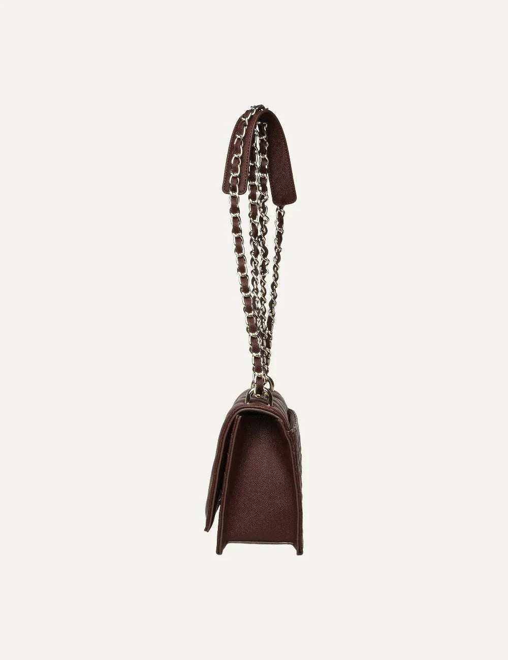 Steve Madden women's chocolate brown quilted shoulder bag with chevron stitched flap, gold tone metal logo and double gold chain strap interwoven with brown synthetic material,  side view