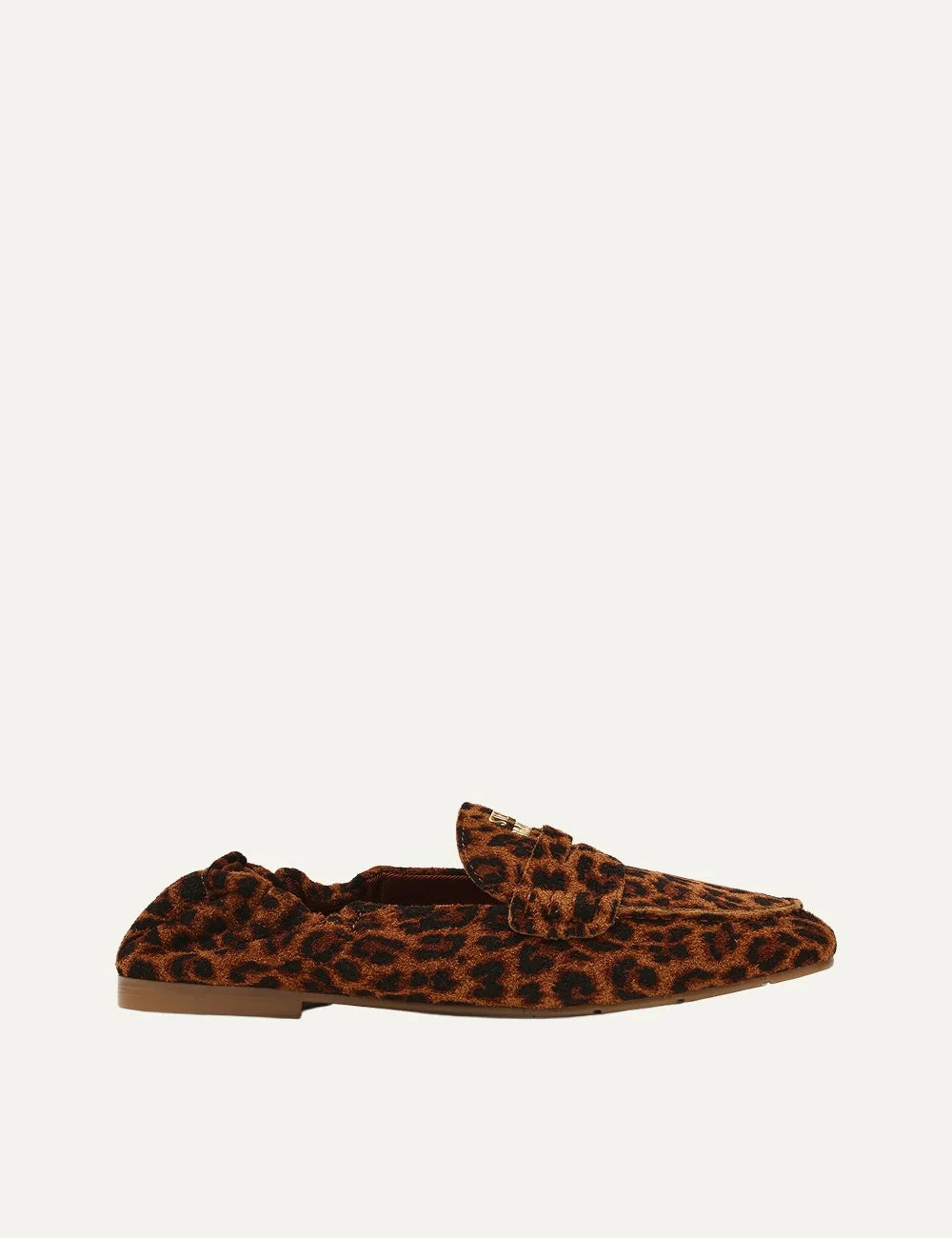 Steve Madden women's leopard print suede loafers in brown and black with decorative penny strap, gold tone metal detail, gathered heel, rounded toe and flat brown sole, side view.