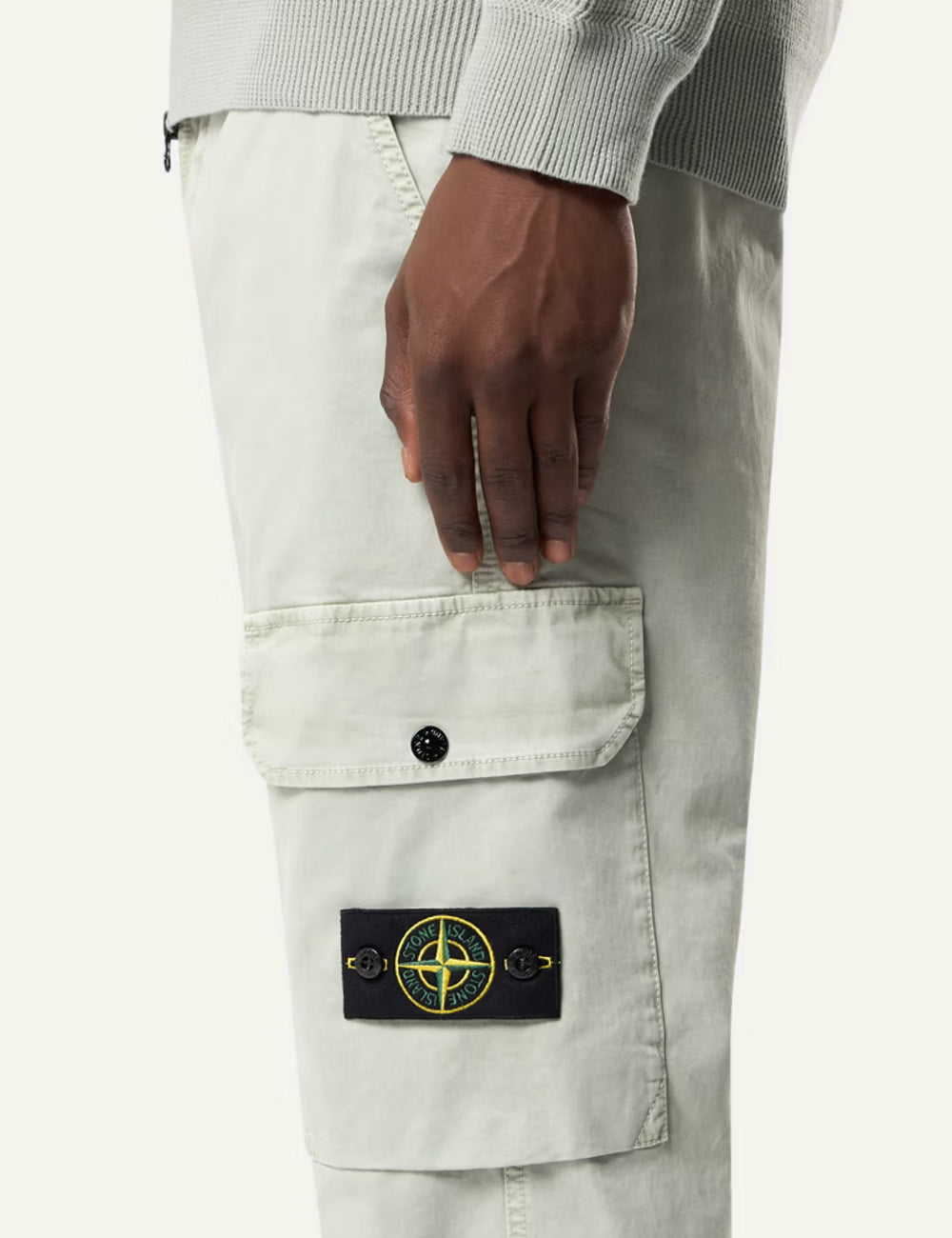 Stone Island cargo trousers in black with side pockets and logo patch side logo view