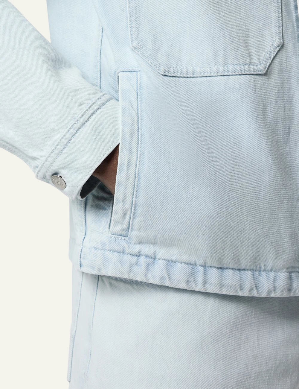 Stone Island coach jacket light blue denim bleached pocket detail view