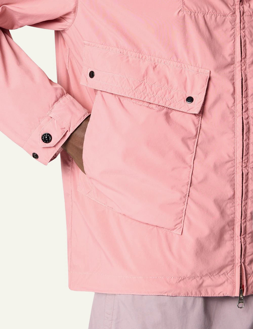 Stone Island hooded jacket in pink with front pockets and logo patch pocket view