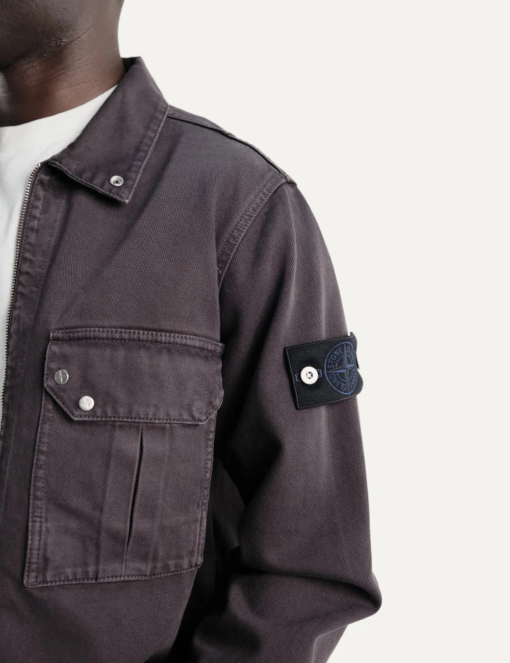Stone Island men's dark burgundy zip-up overshirt with pointed collar, flap chest pocket, faded finish and signature sleeve badge detail
