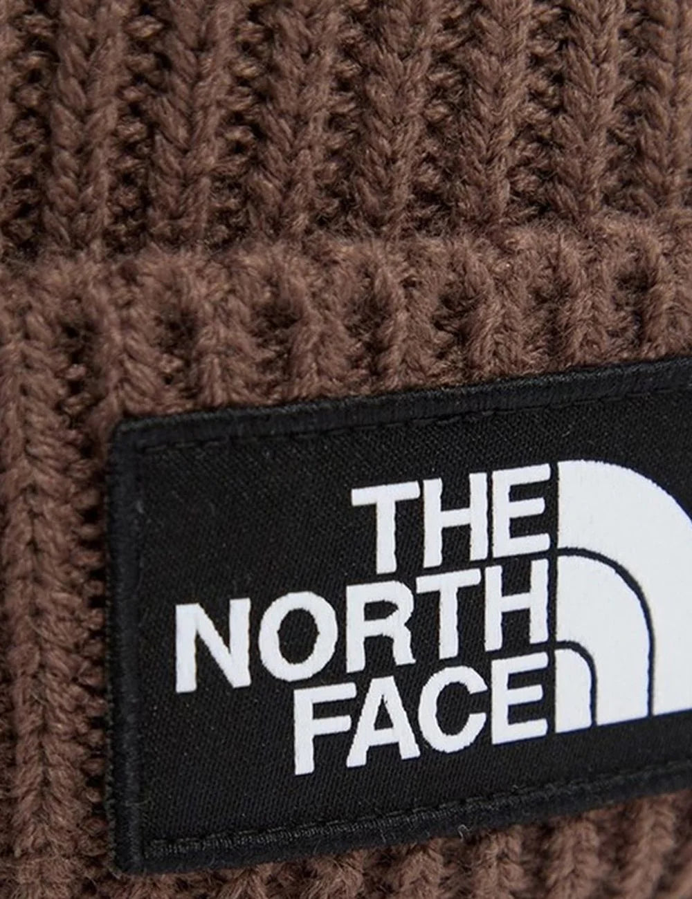 The North Face unisex brown ribbed knit beanie with folded cuff and black logo patch detail