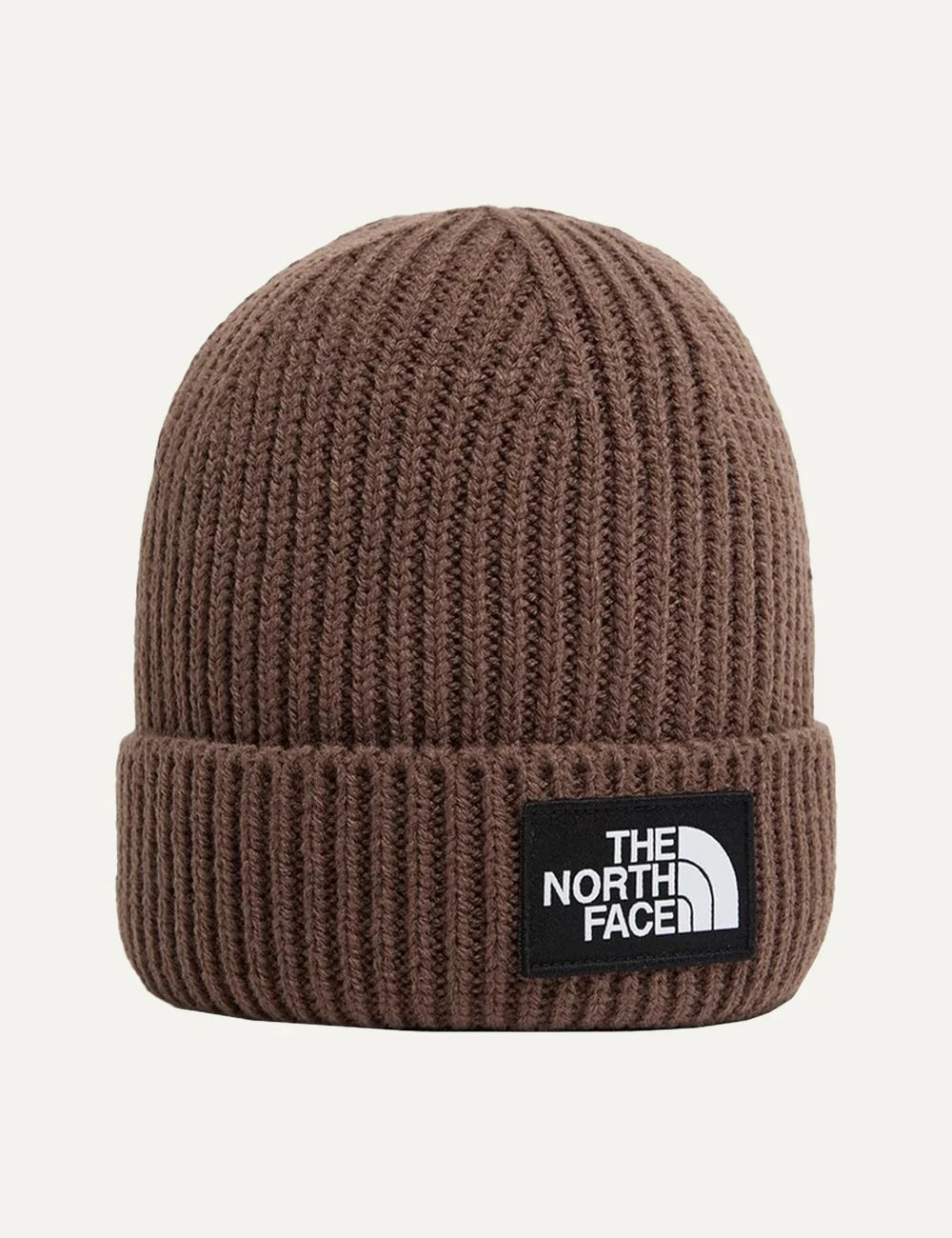 The North Face unisex brown ribbed knit beanie with folded cuff and black logo patch.