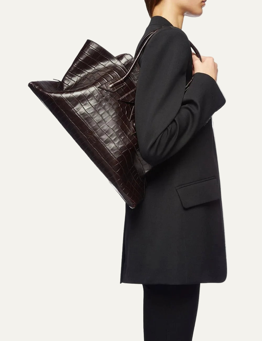 The Attico La Passeggiata Medium coffee brown crocodile print leather top handle bag for women on model