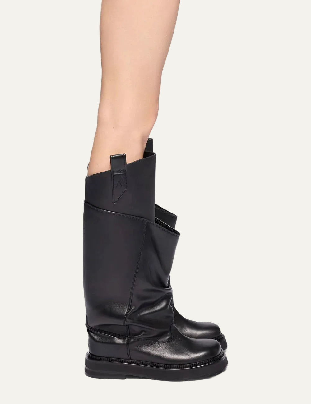 The Attico Robin Passeggiata black leather combat boots for women worn on model