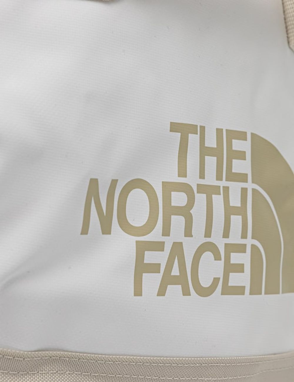 The North Face Base Camp duffel bag cream beige 50L travel front logo view