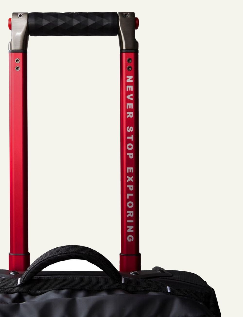 The North Face Base Camp Voyager roller suitcase black front side view logo handle detail zip view