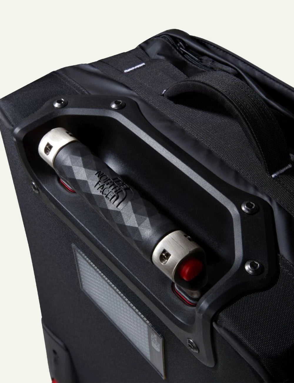 The North Face Base Camp Voyager roller suitcase black front side view logo handle top detail view