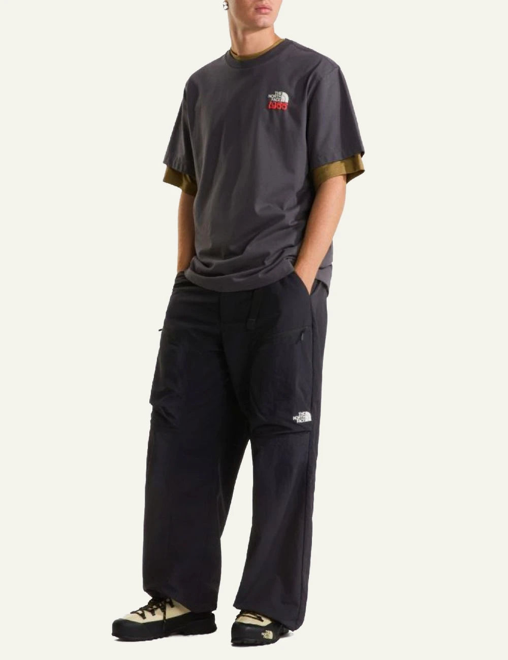 The North Face wide leg nylon pants black relaxed fit adjustable hem front full body view