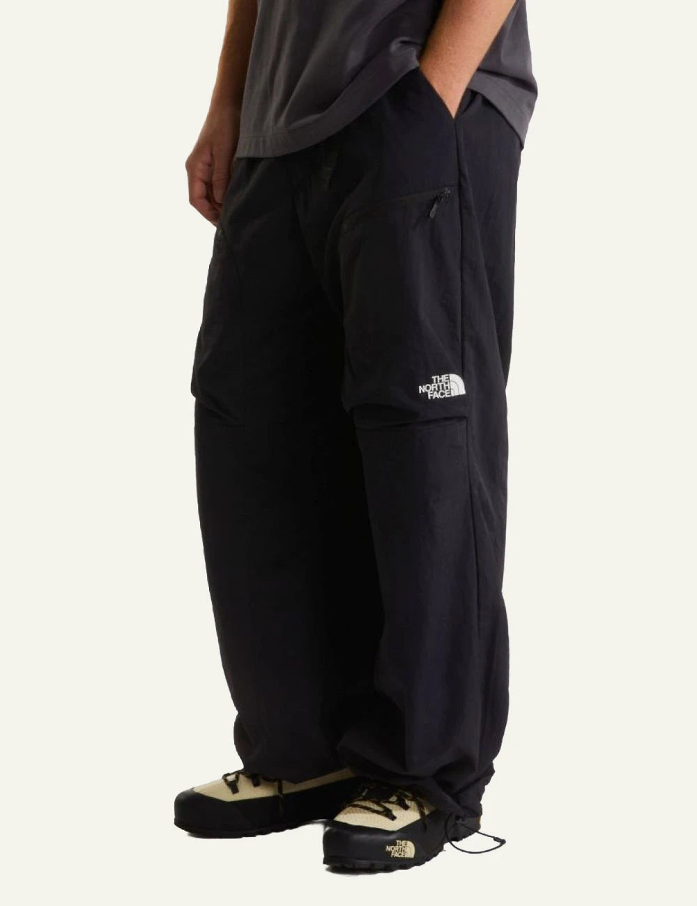 The North Face wide leg nylon pants black relaxed fit adjustable hem side view