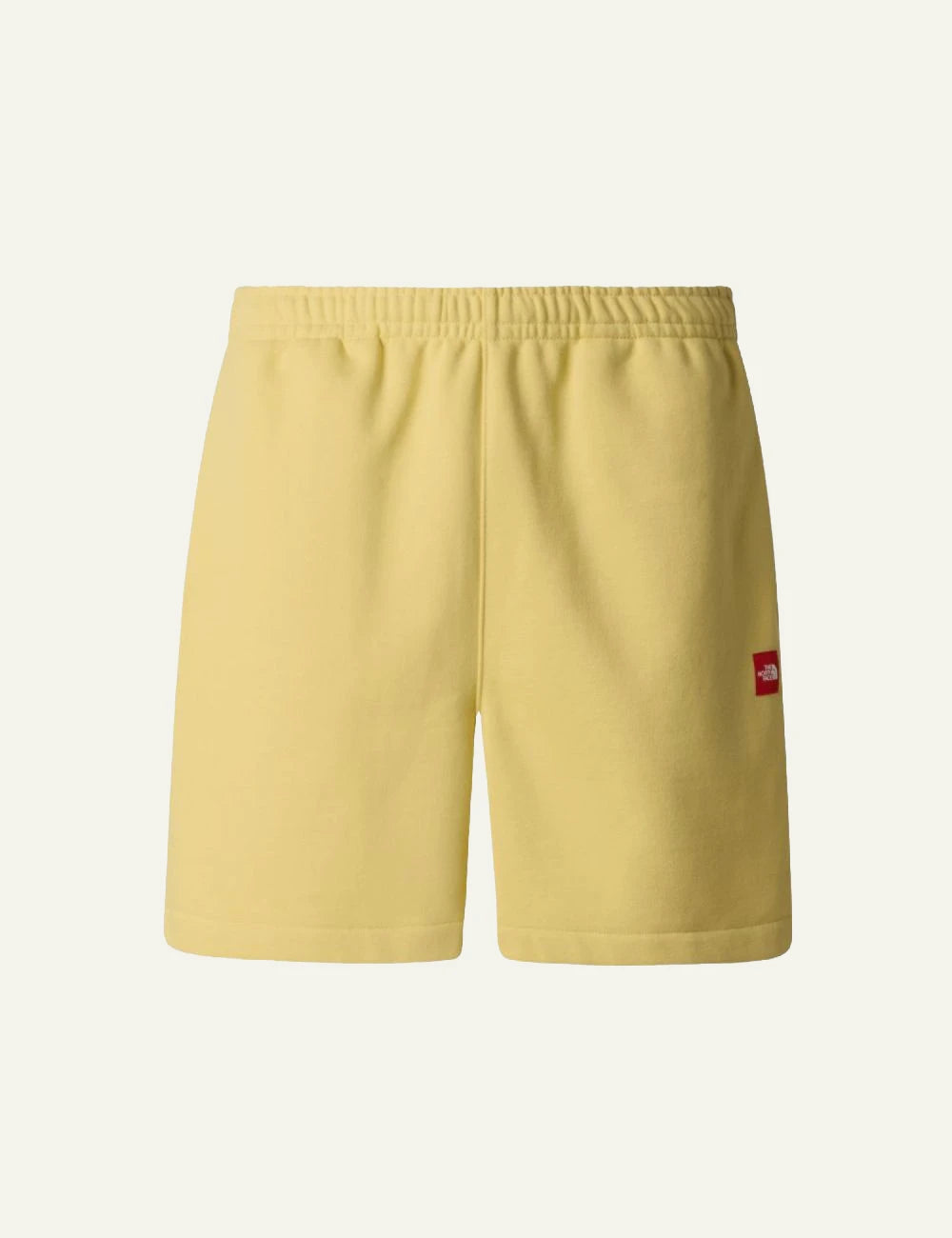 The North Face fleece shorts yellow honeyed sand front view elastic waist logo front flat view
