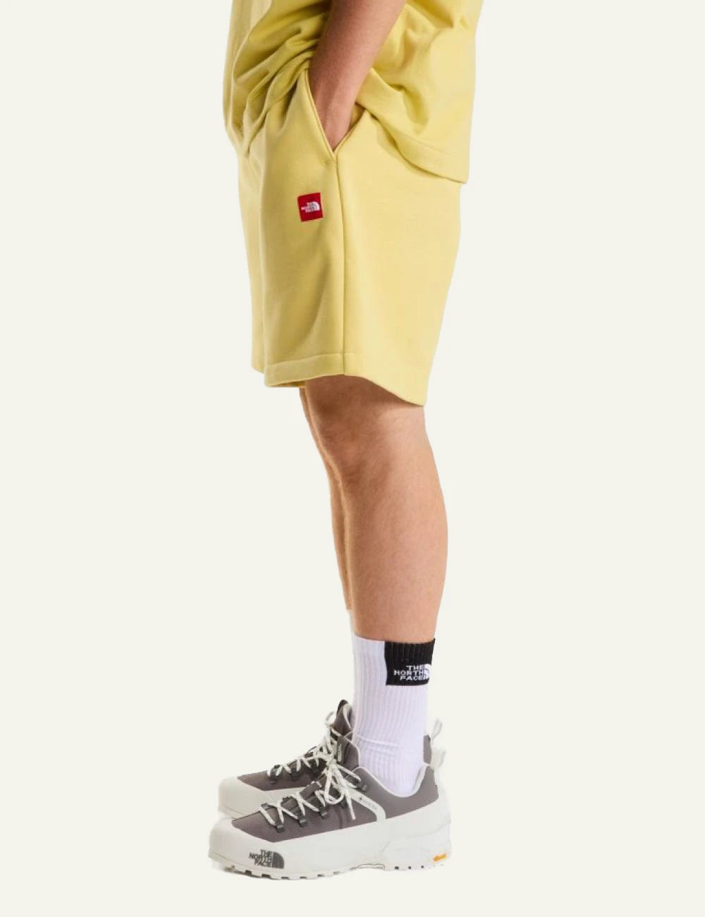 The North Face fleece shorts yellow honeyed sand front view elastic waist logo side view