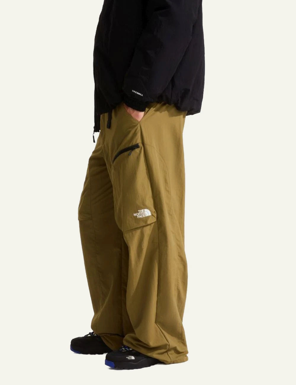 The North Face cargo nylon pants khaki relaxed fit zip pockets adjustable hem side view