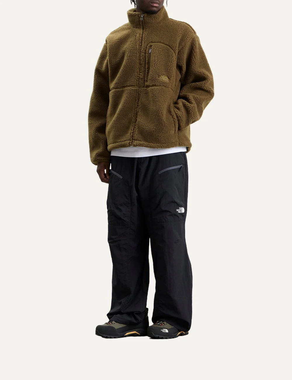 The North Face men's olive green Extreme Pile fleece jacket with textured sherpa fabric, high collar, front zipper and chest pocket full body