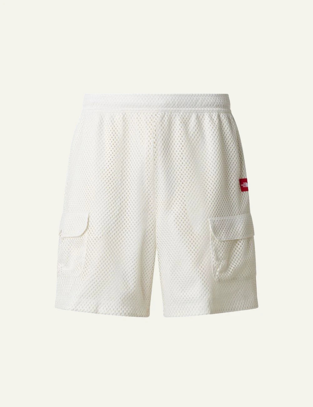 The North Face mesh shorts white elastic waist cargo pockets front flat view