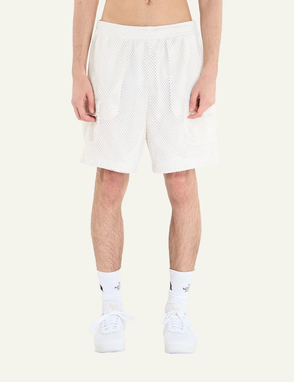 The North Face mesh shorts white elastic waist cargo pockets front model view