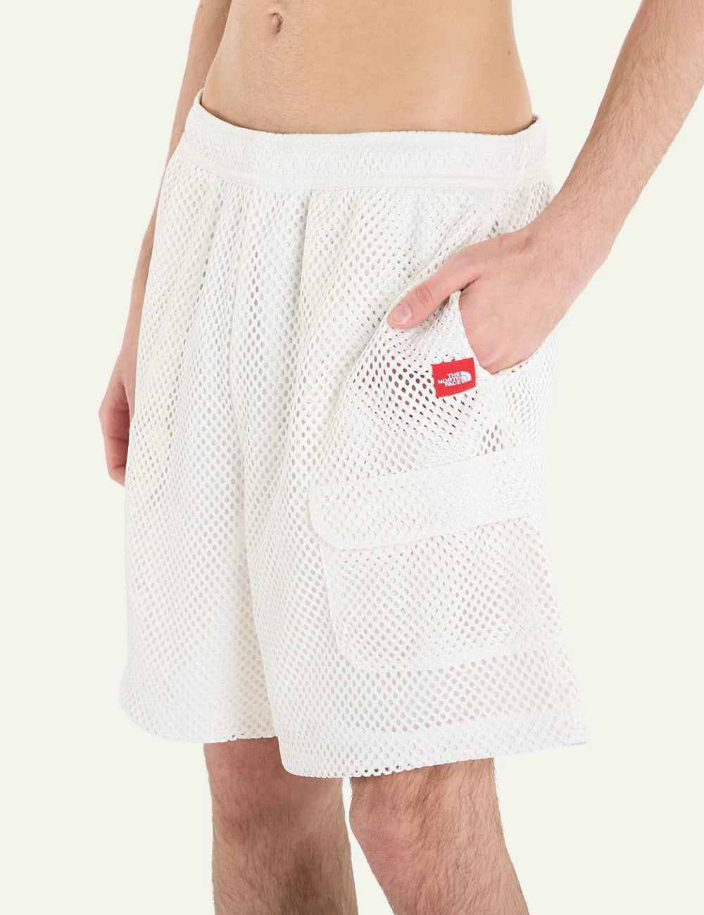 The North Face mesh shorts white elastic waist cargo pockets side view