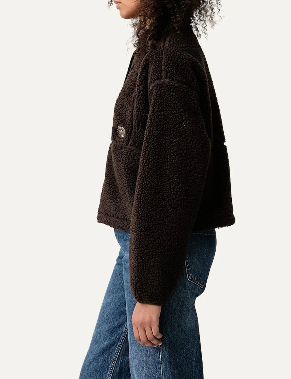 The North Face women's Extreme Pile dark brown cropped fleece jacket with textured sherpa fabric, high collar, front zipper and chest pocket side