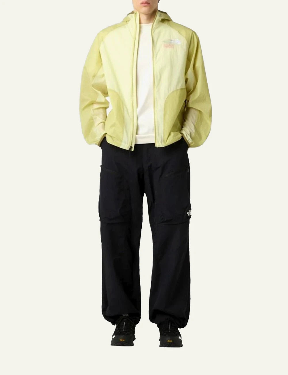 The North Face WindWall jacket yellow lightweight breathable hooded zip front full body view