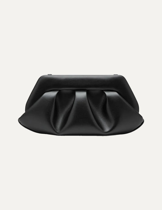 THEMOIRÈ women's black polyurethane shoulder bag with sculptural pleated front, structured silhouette, long shoulder strap and gold-tone hardware.