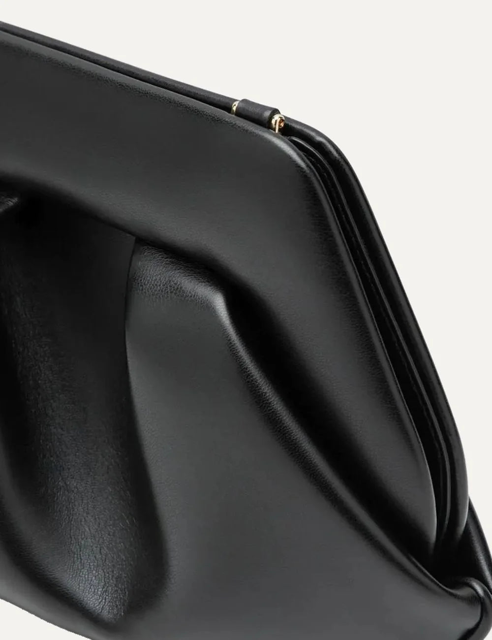 THEMOIRÈ women's black polyurethane shoulder bag with sculptural pleated front, structured silhouette, long shoulder strap and gold-tone hardware side detail