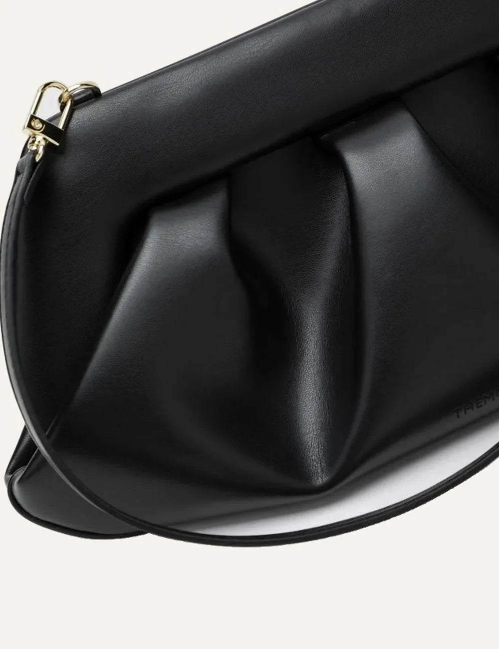 THEMOIRÈ women's black polyurethane shoulder bag with sculptural pleated front, structured silhouette, long shoulder strap and gold-tone hardware detail