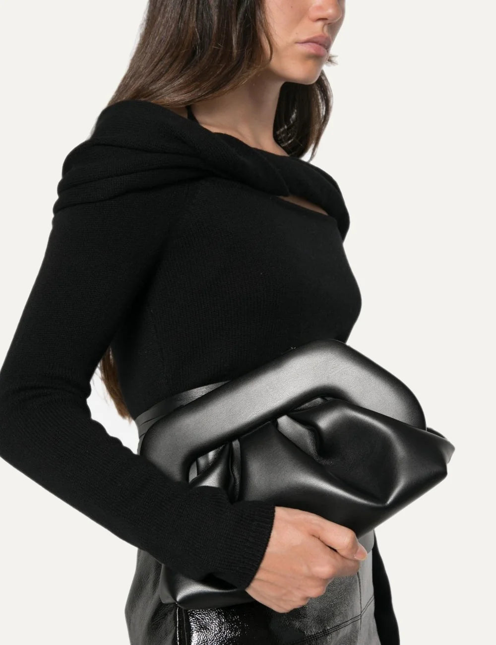 THEMOIRÈ women's black polyurethane clutch bag with smooth finish, sculptural frame, ruched detailing and magnetic closure model