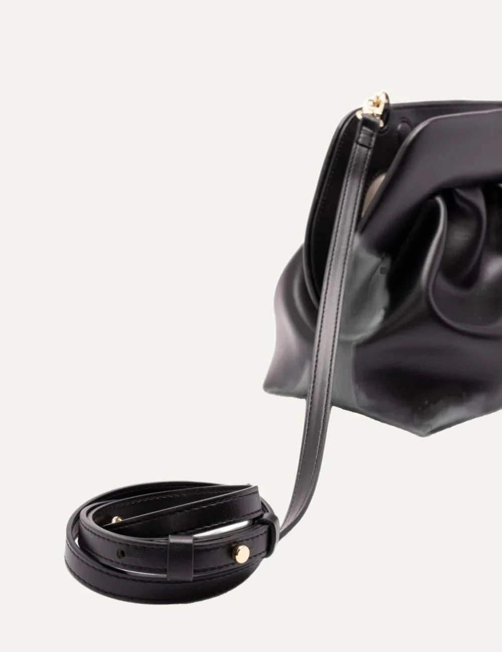 THEMOIRÈ women's black ruched clutch bag with smooth finish, magnetic closure, gold-tone hardware and detachable adjustable shoulder strap detail