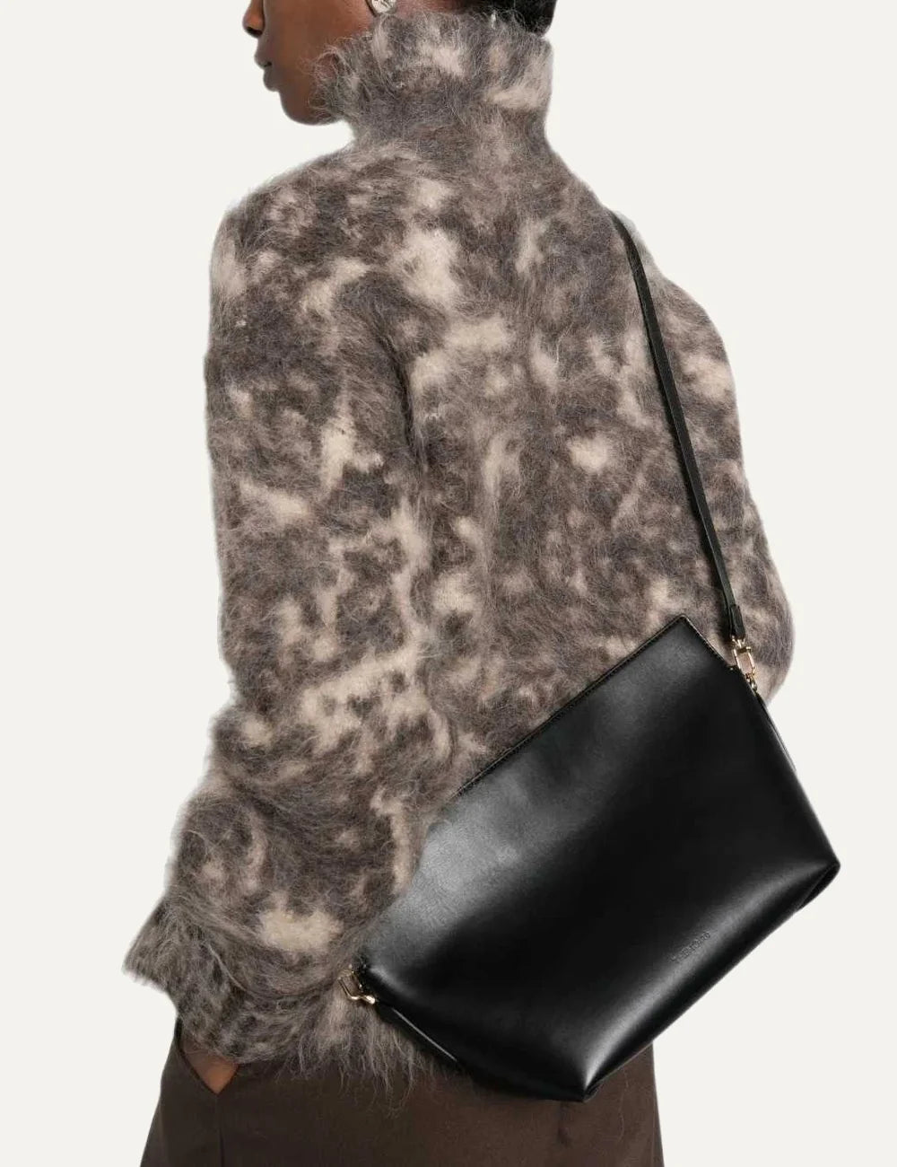 THEMOIRÈ women's Zoe shoulder bag in smooth black calfskin leather with detachable adjustable strap, gold-tone hardware and top zip closure model