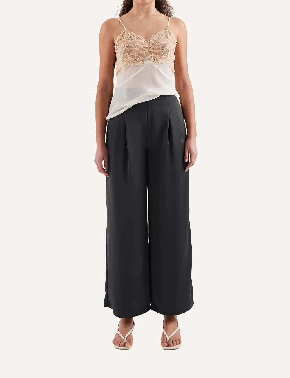 Topshop women's black satin wide-leg trousers with high waist and front pleats.