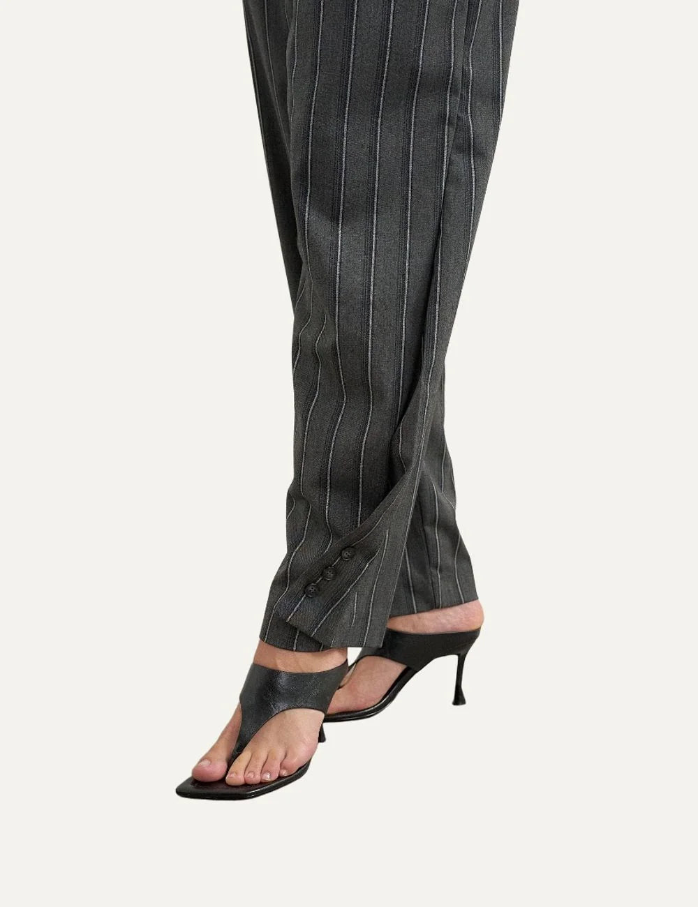 Topshop women's dark grey pinstripe straight-leg trousers with front pleats and button details at the hems detail
