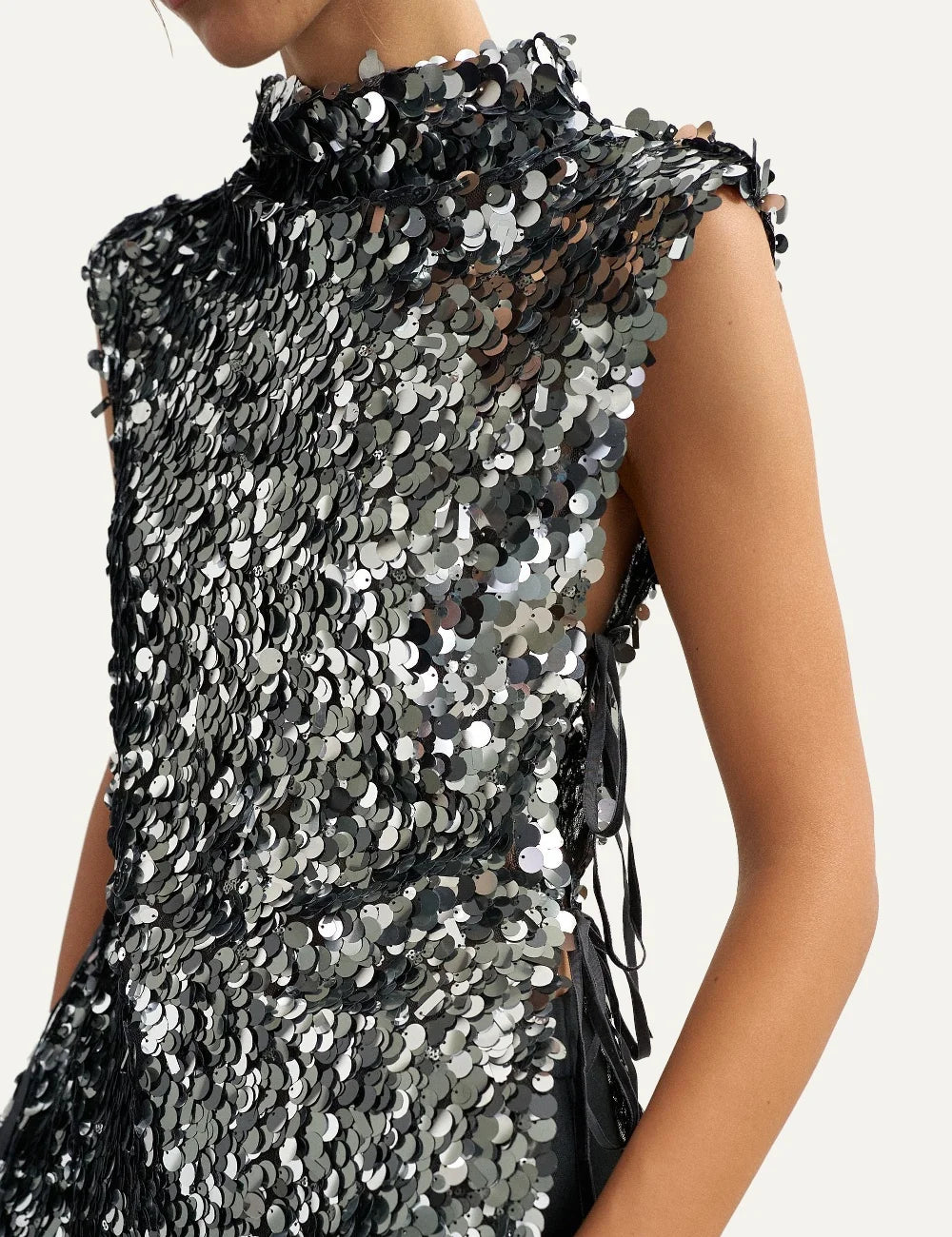 Topshop women's black sleeveless sequin top with silver and black round sequins, high neck and side tie details.