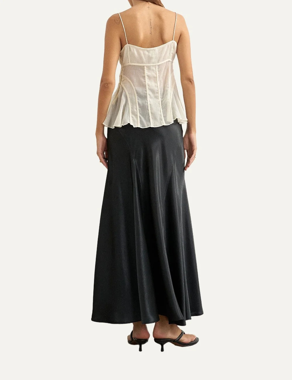 Topshop women's black satin midi skirt with diagonal seam details and flared hem.