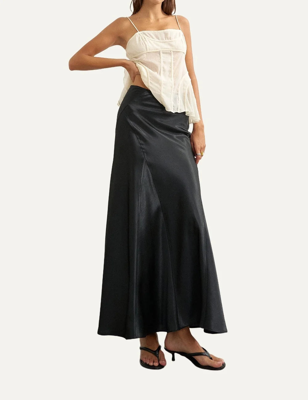 Topshop women's black satin midi skirt with diagonal seam details and flared hem model