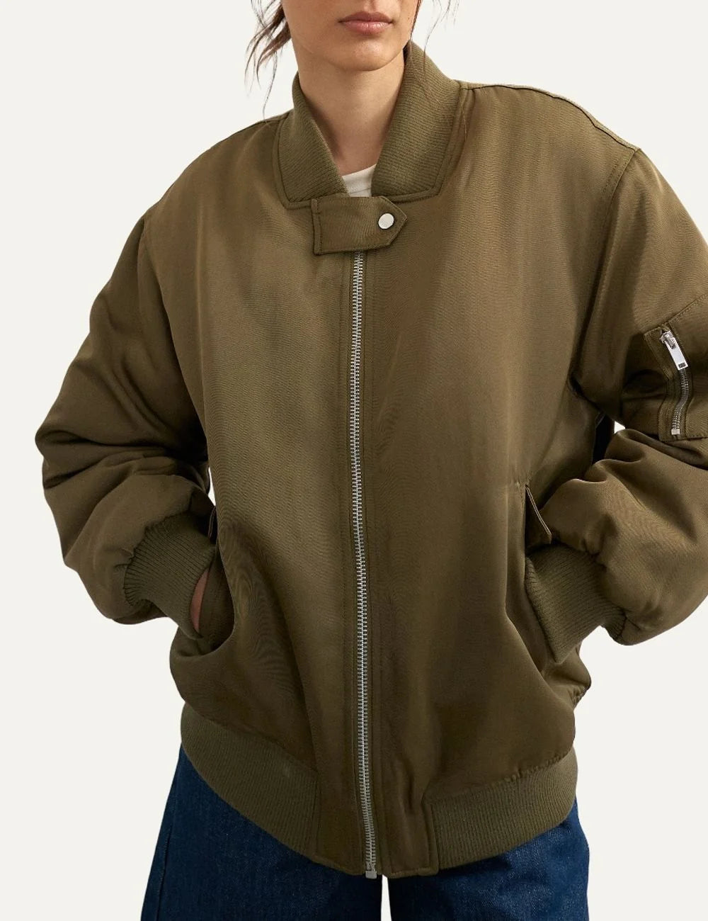 Topshop women's olive green oversized bomber jacket with ribbed collar, front zipper and sleeve zip pocket.