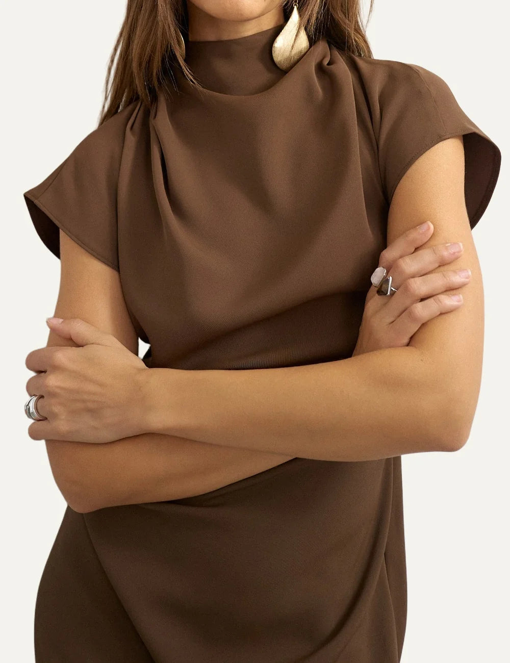 Topshop women's brown mini dress with high neckline, short sleeves, draped front and open back with scarf detail model