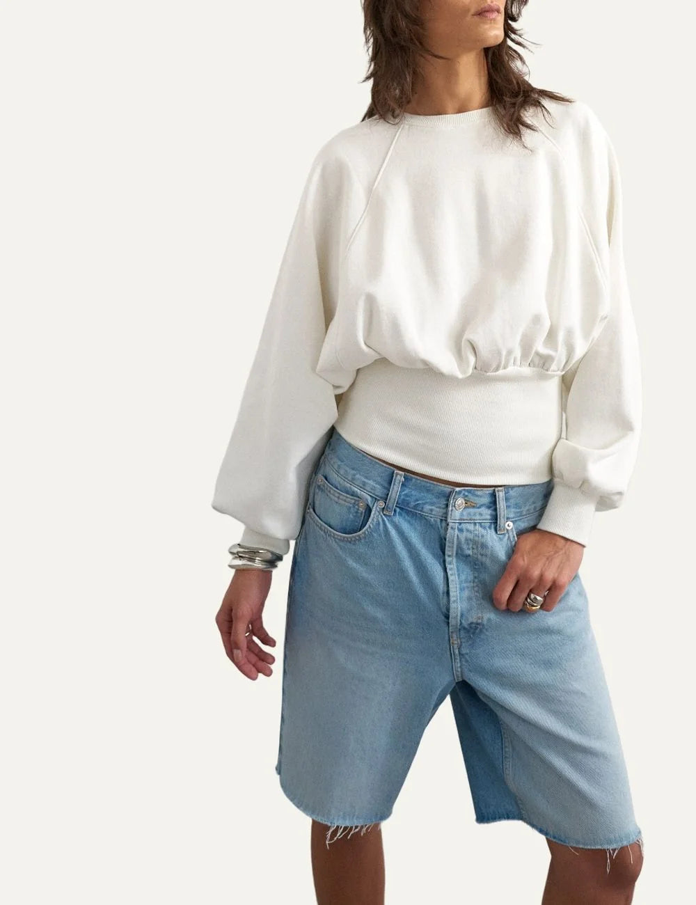Topshop women's ecru cropped sweatshirt with crew neck, long raglan sleeves and wide ribbed cinched waist.