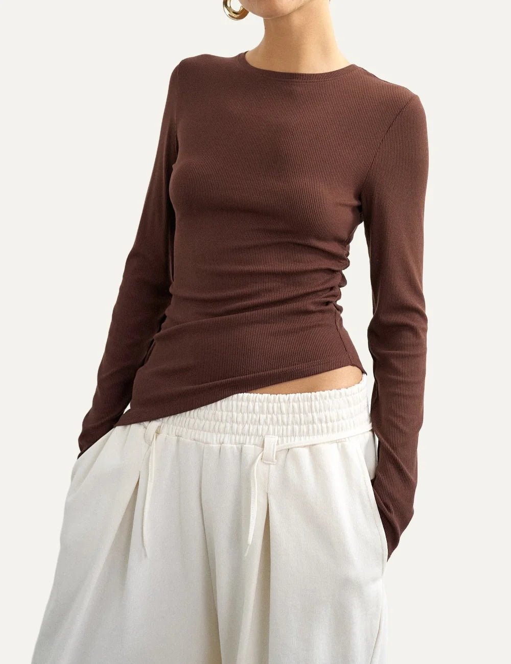 Topshop women's brown ribbed long-sleeve top with crew neck, side ruching and asymmetric hem model
